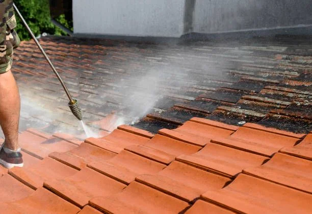 Pressure washing roof tiles